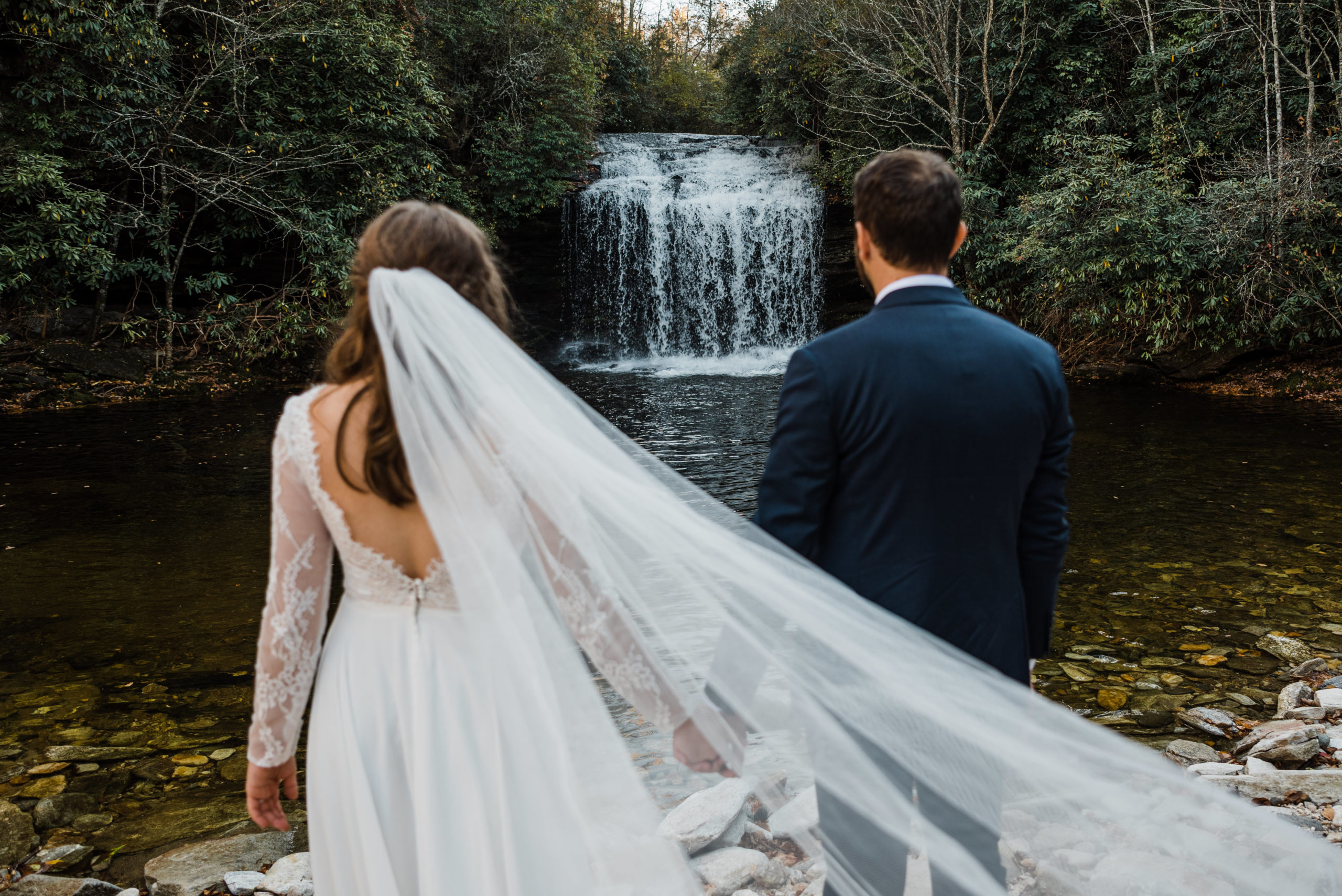 Eloping couple in front of a North Carolina waterfall