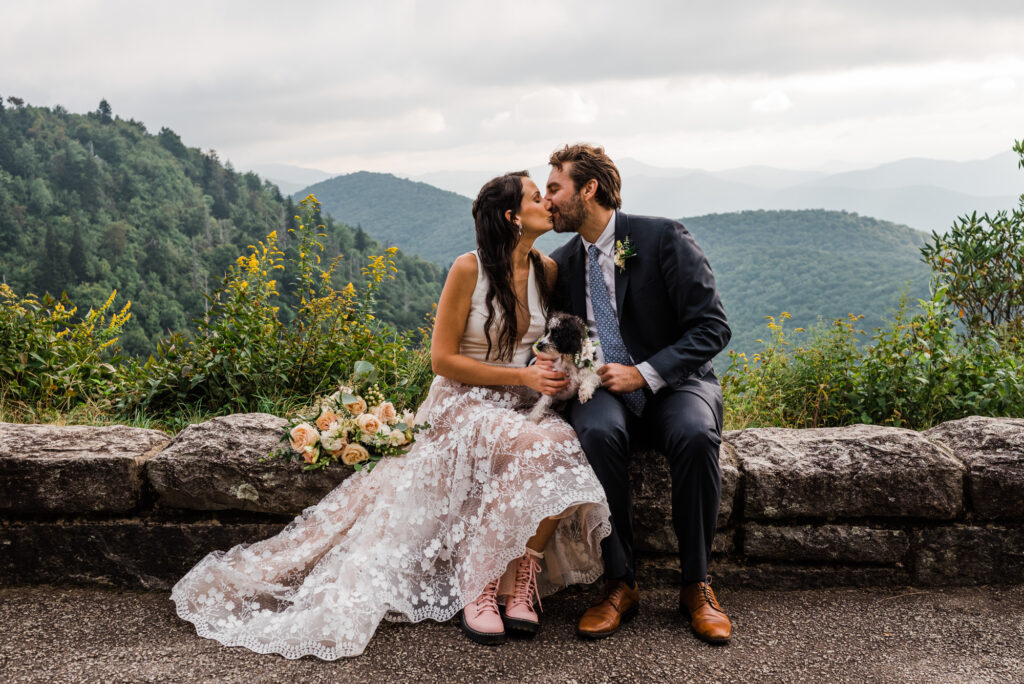 Couple kissing at an overlook on the Blue Ridge Parkway